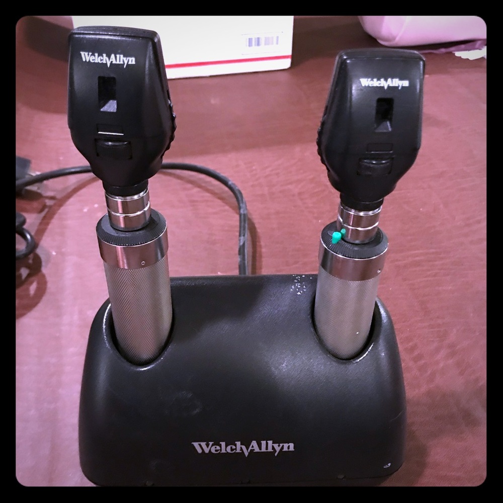 Two Welch Allyn Ophthalmoscopes with charger.